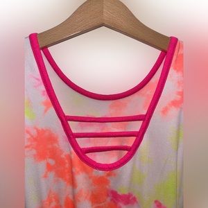 Pixie Lane pink, yellow, white, and orange tie dye shorts romper.